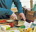 Becel lifestyle, man cutting cheese